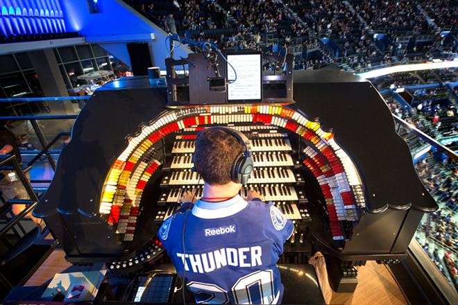 Krystof Srebrakowski, organist for the Tampa Bay Lighting, plays the largest of its kind in the NHL  at Amalie Arena in Tampa, Florida on October 20, 2016. - CHIP WEINER