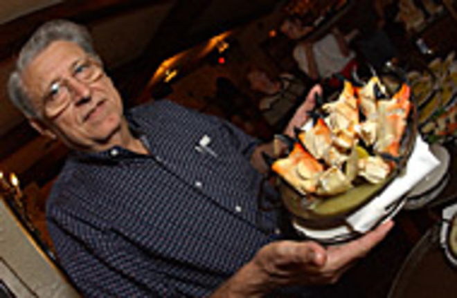 MAKIN' IT SNAPPY: Tio Pepe owner Jesus Exposito brandishes - a platter of stone crab claws.<i - Sean Deren