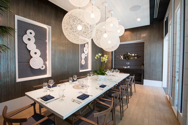The Asian fusion restaurant features a beautiful glass private dining room on the right as you enter. - Nicole Abbett