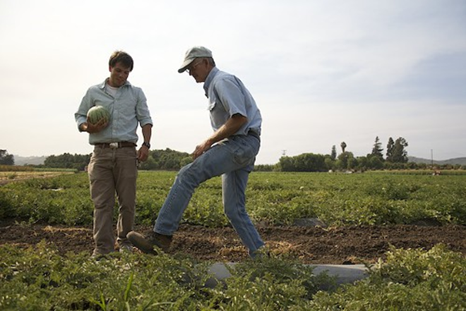 In Organic We Trust's Kip Pastor (left) with one of the farmer's featured in his latest film. - IN ORGANIC WE TRUST