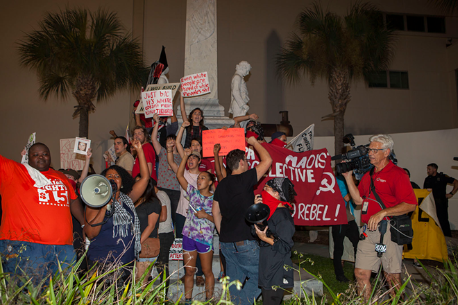 Protesters marched to the infamous Confederate monument in downtown Tampa that is slated for removal. - Kimberly DeFalco