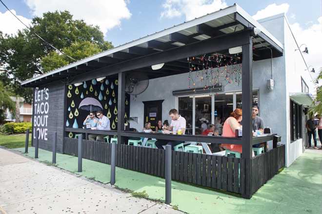 The restaurant's AstroTurf-lined patio with a fun "raining avocados" mural offers outdoor dining. - Chip Weiner