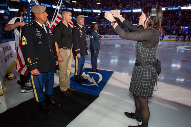 Kelli Yeloushan readies Hayden Lopez (center) for for an enlistment ceremony at Amalie Arena in Tampa, Florida on October 20, 2016. - Chip Weiner