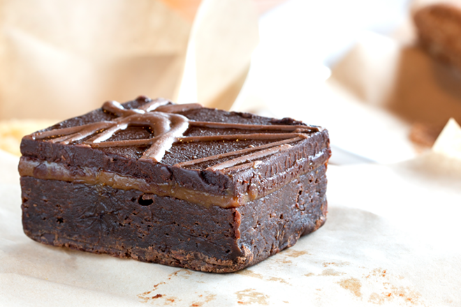 With caramel nestled in the middle, the caramel ganache brownie has a cake-like bottom and thin chocolate topping. - Chip Weiner