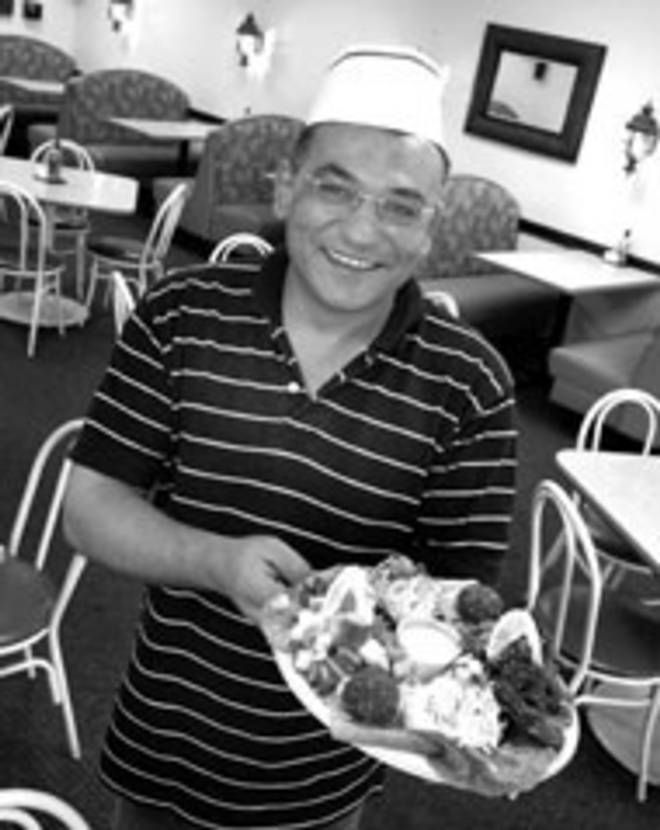 ARABIAN RIGHT: Baraka owner Yehia Khalifa serves - fresh Middle Eastern fare at the Tampa restaurant. - Sean Deren