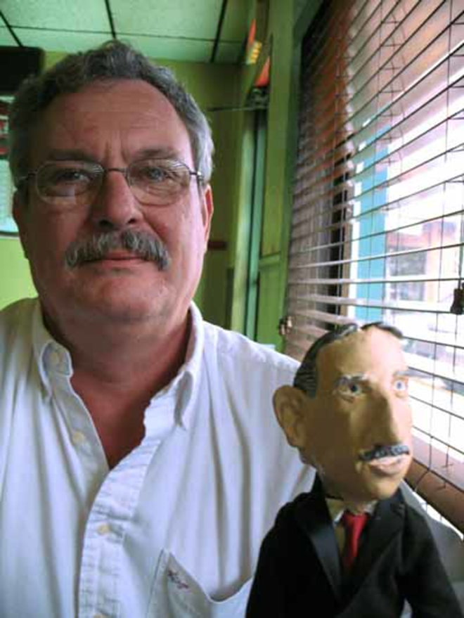 RENEGADE COP? Recently retired St. Petersburg police officer Ken Kokotek, aka "Picasso," with a Mayor Baker doll he made himself. - ALEX PICKETT