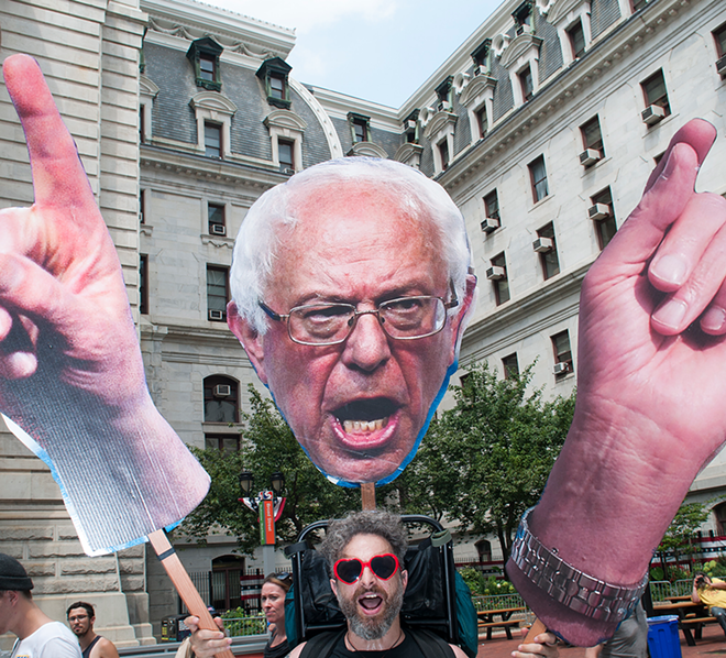 Bernie Sanders loomed over everything, including protests like this one outside Philly's City Hall. Ivan Delsol came from Cottage Grove, Oregon with hIs larger-than-life Sanders. "He is the most hopeful presidential candidate in my lifetime," said Delsol. - Joeff Davis