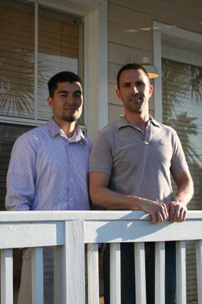 Jose Garboza and Tony LaColla on a porch at their Ybor condo. - David Warner