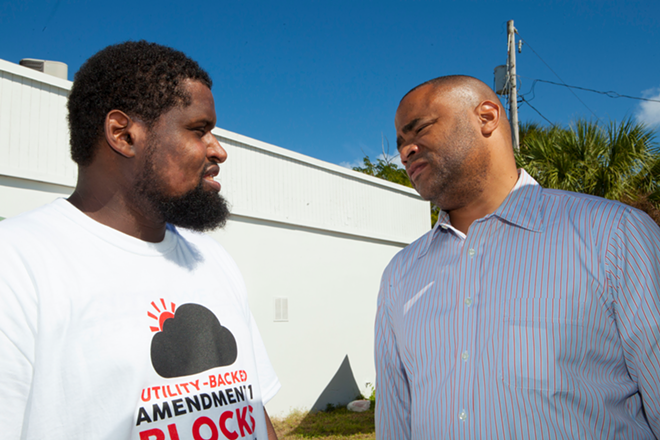 Fight for 15's Kofi Hunt, one of the organizers of St. Petersburg's Souls to the Polls Block Party, chats with Texas Congressman (Dist. 33) Marc Veasey who flew in from Fort Worth to help with voting. - Kimberly DeFalco
