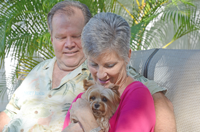 GOING THROUGH IT TOGETHER: Mike and Judy Baggs and their Yorkshire terrier, Millie. - Cathy Salustri