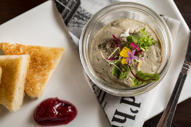 Chicken liver pâté is beautifully presented with toast triangles and a mound of onion marmalade. - James Ostrand