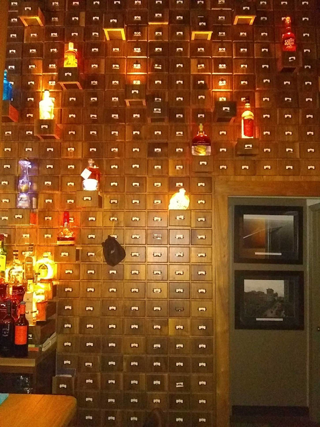 Card catalog-cum-liquor cabinet likely holding the deadly absinthe at Room 901. - Ben Wiley