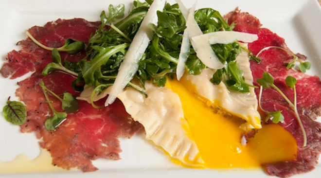The beef carpaccio with house-made ravioli, poached egg and leek and goat cheese mousse. - Lisa Mauriello