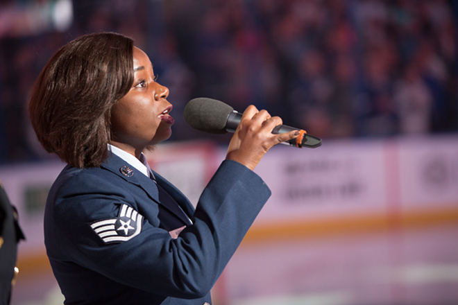 Staff Sgt. Cherrelle Warren sings the national anthem at Amalie Arena in Tampa, Florida on October 20, 2016. - Chip Weiner