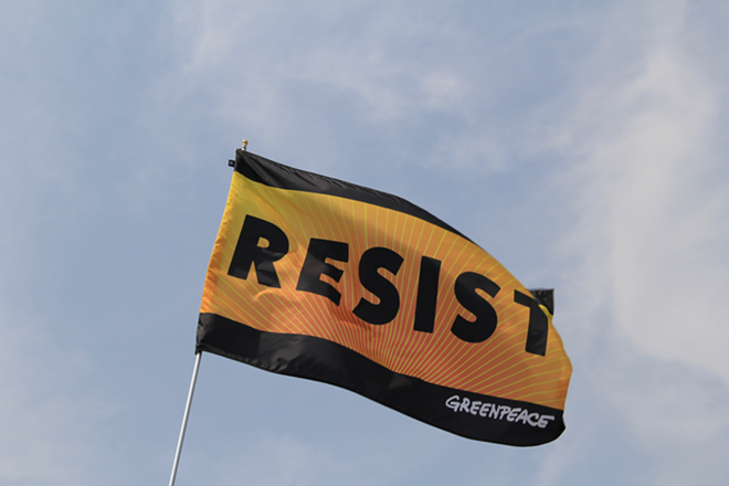 Greenpeace Resist banner during the 2017 People's Climate March. - By Dcpeopleandeventsof2017 (Own work) [CC BY-SA 4.0 (http://creativecommons.org/licenses/by-sa/4.0)], via Wikimedia Commons