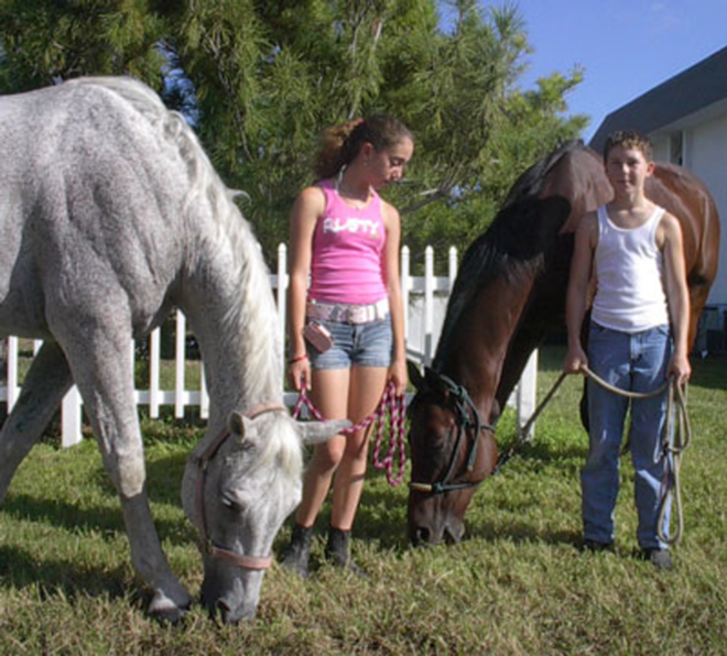 HOLD YOUR HORSES: Jade Baranich &amp; Alex Valentin brought their pets to be blessed. - Scott Harrell