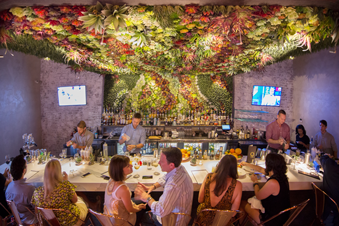 The ceiling and back wall of O's bar are an L-shaped 3D mural with a colorful mosaic of succulents. - Chip Weiner