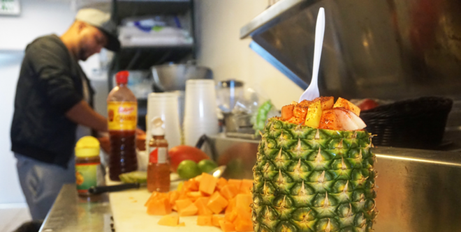 This fruit cup features papaya, pineapple, chili powder and a drizzle of Mexican condiment chamoy. - Alexandria Jones