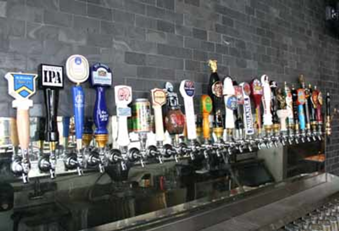 ON TAP AT TAPS: Imported brews dominate the offerings at Taps Wine & Beer Merchants. - Eric Snider