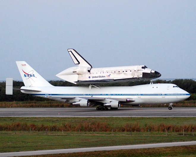 Shuttle Discovery atop a NASA 747 just before takeoff this morning at Kennedy Space Center - www.starznbarz.com