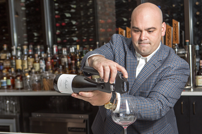 NO WASTE: Haven wine director Gregory Mayer demonstrates the Coravin. - CHIP WEINER
