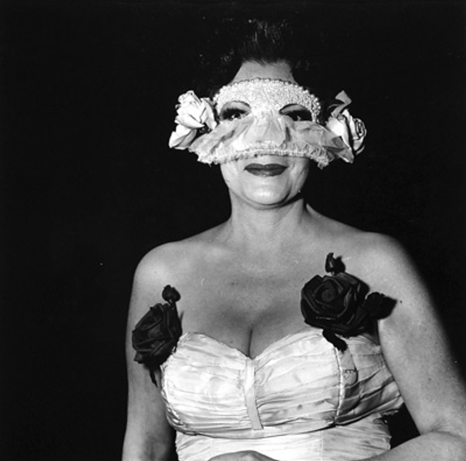 MASKED AND ANONYMOUS: Diane Arbus' "Lady at Masked Ball with Roses on her Dress." - Collection Of David R. Hall Iii