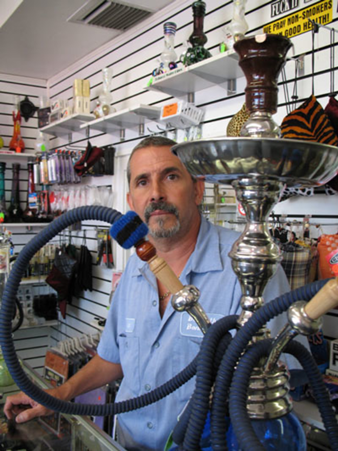 WHERE THERE'S SMOKE: Leo Calzadilla in his St. Pete shop, Purple Haze. - ALEX PICKETT