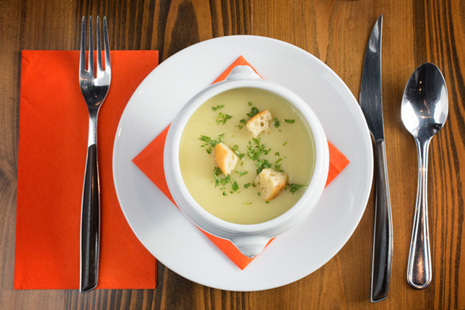 So Gourmet's vichyssoise is creamy and seductive topped with crisp croutons and flecks of green herb. - Chip Weiner