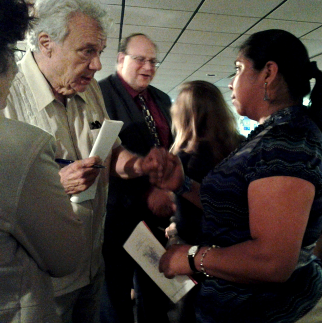 CIW member Lupe Gonzalo, right, talks with guests after her presentation at the Florida Holocaust Museum. - Meaghan Habuda