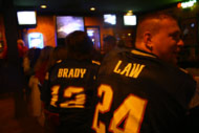 TEAM SPIRIT: Michelle (Brady) and Richard (Law) - watch the game at Wing House. - Max Linsky