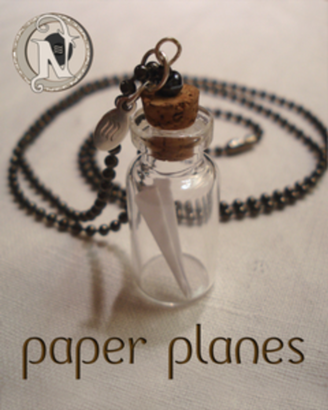 Never Take It Off: Merch with meaning from the Simms siblings - Paper Planes necklace for NTIO by Spencer Chamberlain