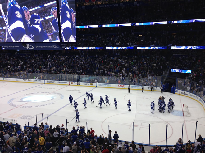 The Lightning congratulate goalie Kristers Gudļevskis after winning the last game of the regular season in a shoot out with the Washington Capitals. - Nicole Abbett