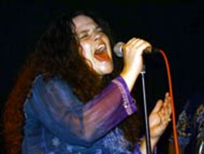 CHANNELING JANIS: Wendy Rich doesn't try to - act like Janis when she's fronting the Holding - Company -- but she's got Joplin's hair. - FRANZIS-WETZLAR