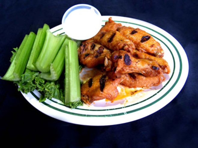 NOSH AWAY: Midtown's Chicken Wings appetizer, with their distinctive grill marks. - Valerie Troyano