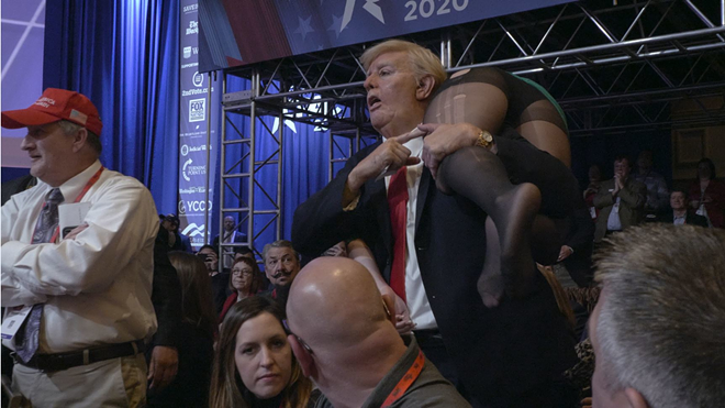 Sacha Baron Cohen, dressed as Donald Trump, crashes Vice President Mike Pence's speech at the annual CPAC convention. - Amazon Studios