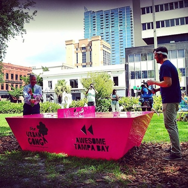 Tampa Mayor Bob Buckhorn (left) and Urban Conga founder Ryan Swanson go head to head at the unveiling of "Ping Pong In The Park" on July 25. - Instagram (@theurbanconga)