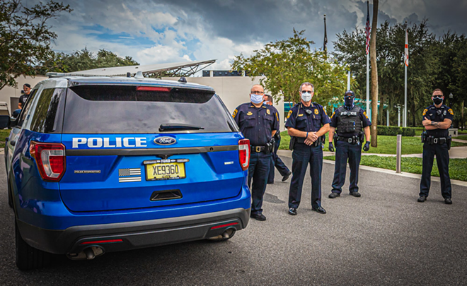 Police officers stand by during a protest in New Port Richey, Florida on Aug. 23, 2020. - Dave Decker