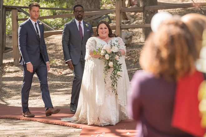 Kate walks down the aisle with her two best men by her side in the This Is Us season two finale. - RON BATZDORFF NBC