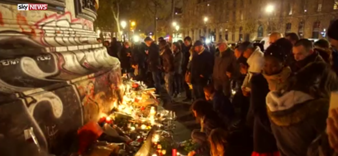 Mourners pay tribute in Paris after the attacks. - SkyNews