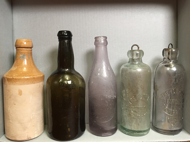 A history of Tampa Bay beer in five bottles, l-r: From earliest to more recent bottles of beer (first two are likely from breweries outside Florida). - Cathy Salustri