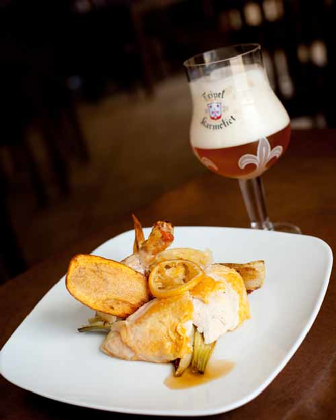 NICE PAIRING: The Refinery's roasted chicken (here with roasted fennel, truffle chips and roasted lemon) goes nicely with one of the restaurants ever-changing selection of beers. - jamesostrand.com