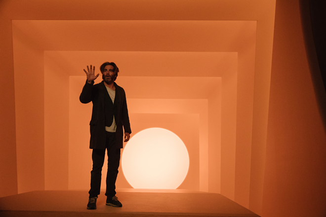 Chris Pine, trapped in a giant orange light box, dreams of the days when audiences were only upset about Khan's poorly kept secret. - Walt Disney Pictures