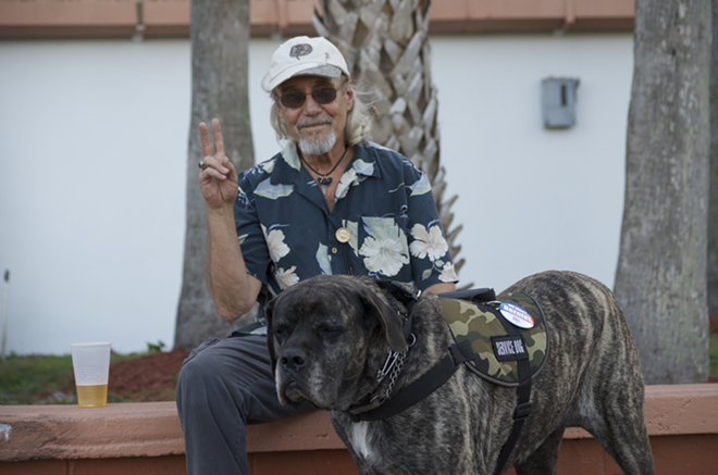 Bill Valliere and his dog, Zoe, feel the Bern. - ivy ceballo