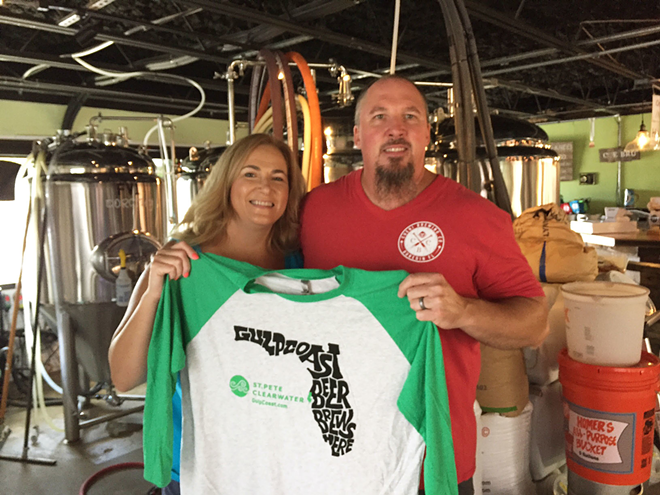 Cueni Brewing Co. owners Bren and Jon Cueni hold up a Gulp Coast T-shirt. - Courtesy of Visit St. Pete/Clearwater