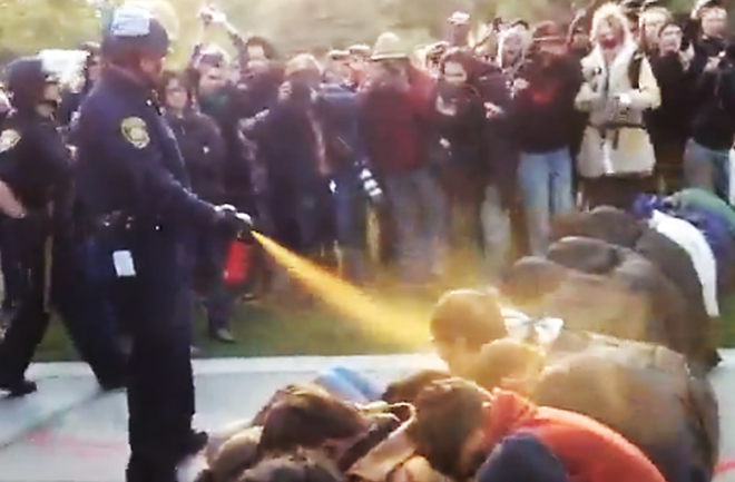 Clip from a video of police pepper-spraying students at a protest at UC Davis in 2011. - Truthout.org