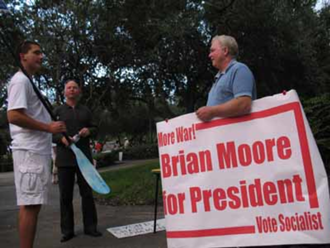 Brian Moore talks with a voter in St. Petersburg. Moore, a Spring Hill resident, is running for president on the Socialist ticket. - Alex Pickett