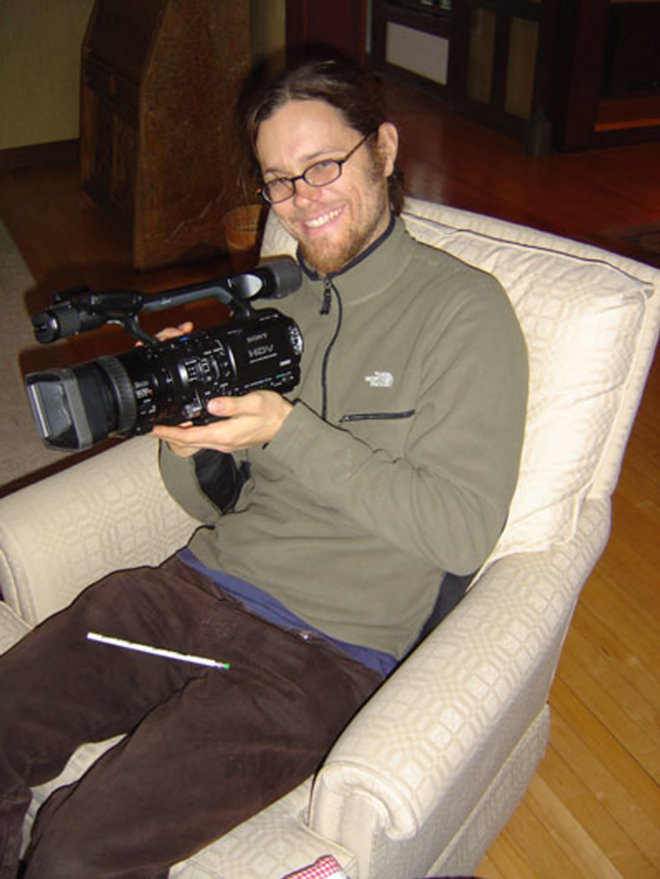 Brad Will, camera in hand - Courtesy The Brad Will Foundation