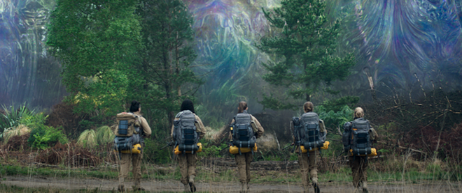 A military science team approaches the Shimmer, a vibrant, living cloak of alien origin that's enveloped a part of the U.S. now known as Area X. - Paramount Pictures and Skydance