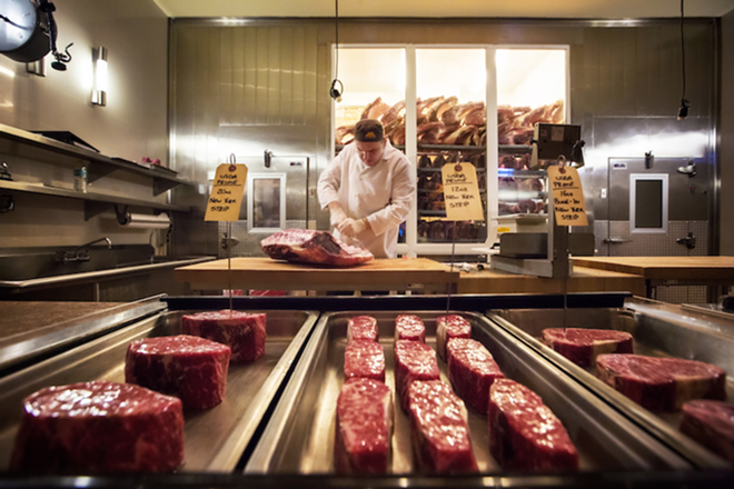 CHOPPING BLOCK: The butcher at Council Oak hard at work on some prime cuts of aged meat. - CHIP WEINER