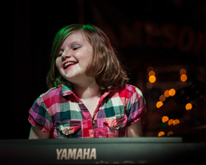 Molly Tingler, 9, at last year's Girls Rock Camp St. Pete showcase at The Local 662 in St. Petersburg, Florida. - Alastair St. Hill